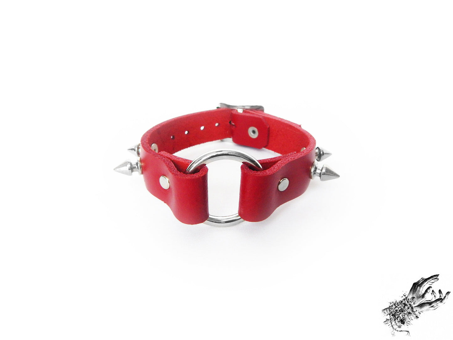 Red leather wristband featuring a central silver O ring and bold 13mm spike studs for gothic and punk fashions