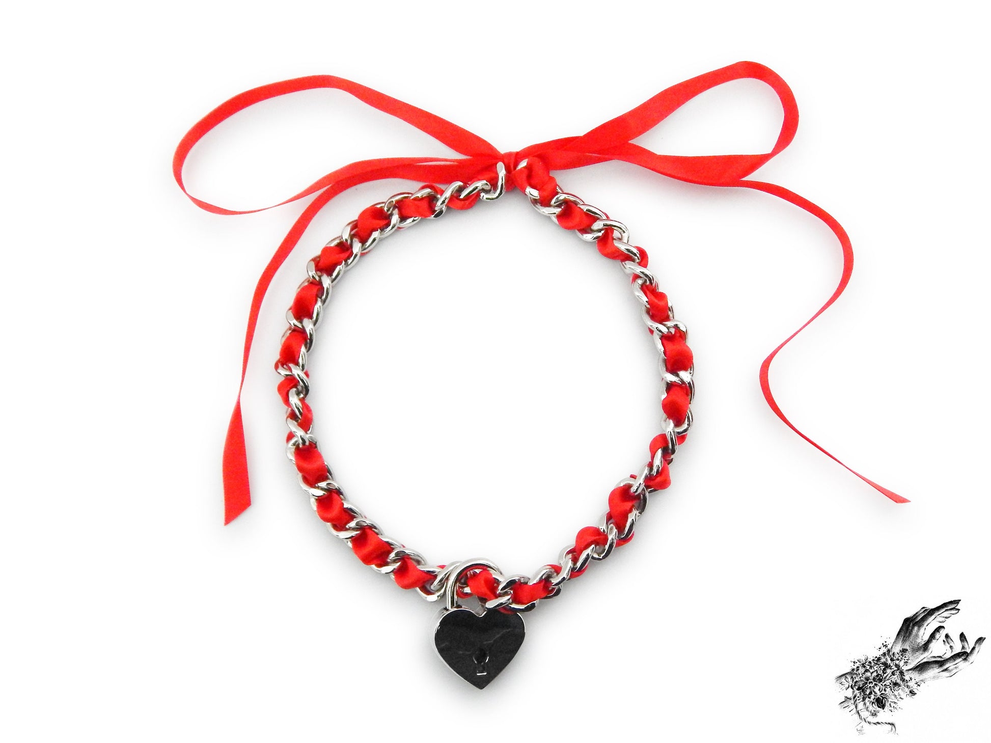 Silver chain choker threaded with red satin ribbon, featuring a removable central silver heart padlock with matching key, displayed on a white background.
