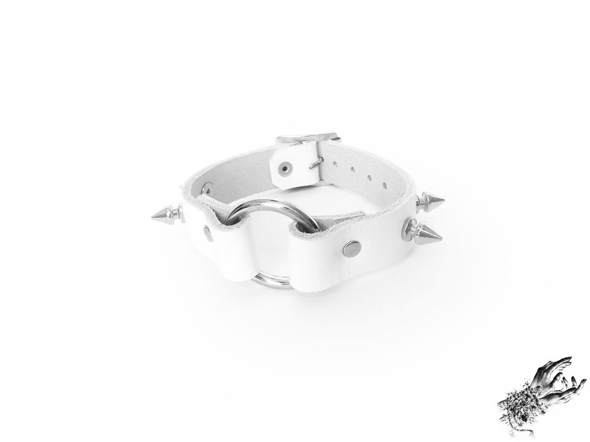 White studded O ring wristband made with genuine leather and stainless steel plated hardware, for pastel goth and punk fahsion in the UK
